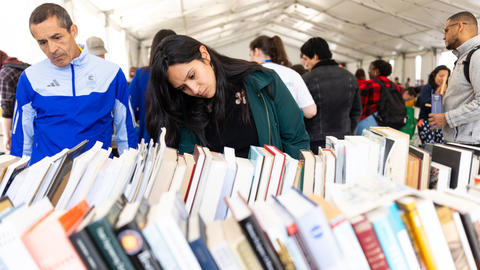 People browsing books at a reuse event