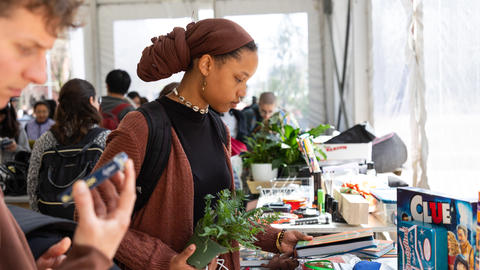 Two people browsing items at a reuse event