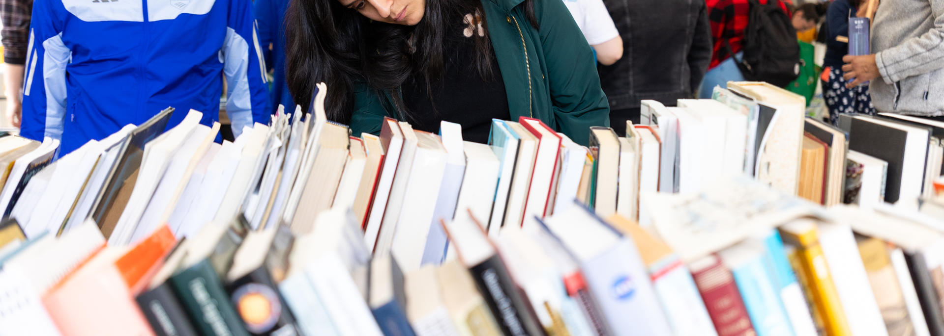 People browsing books at a reuse event