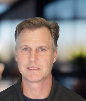 Headshot of a man in a polo