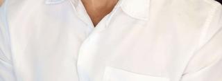 Headshot of a man in a white button-down