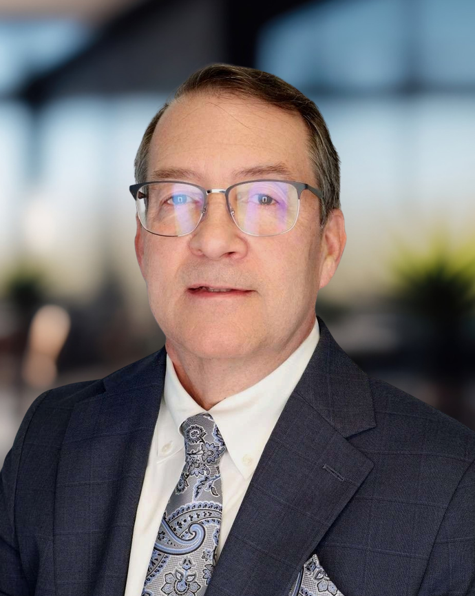 Headshot of a man in business attire