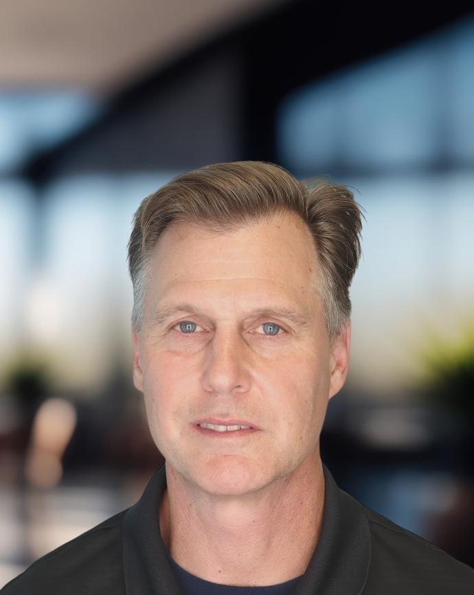 Headshot of a man in a polo