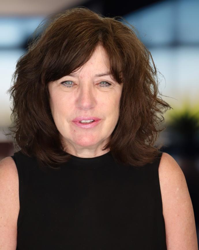 Headshot of a woman in a black shirt