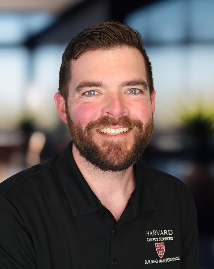 Headshot of a man in a polo