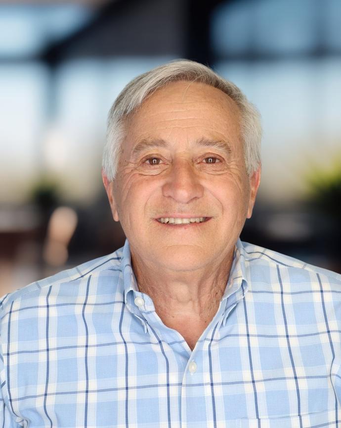 Headshot of a man in a button-down